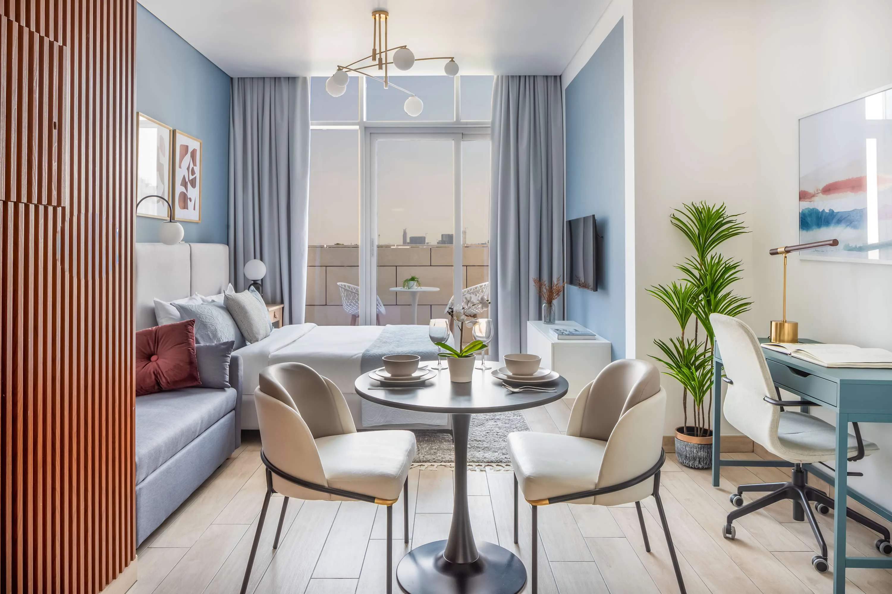 Curated Modern Studio With Home Office Setup In Dubai's Burj Daman Tower
